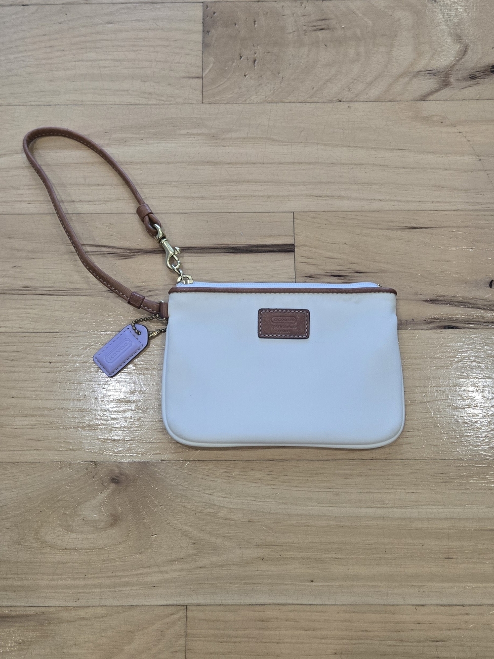 Coach White Wristlet with Tan Trim And Lavender Logo Tag